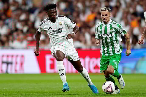 La Liga 2024-25 Real Madrid vs Real Betis: Real Madrid's Aurelien Tchouameni, left, challenges Betis' Pablo Fornals